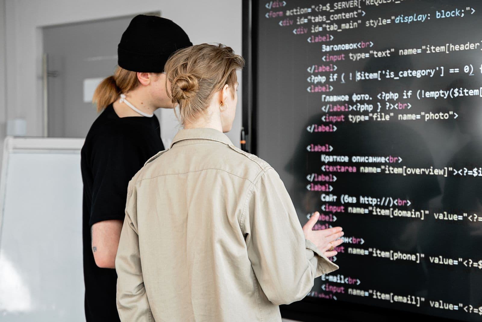 Developers reviewing an integration flow on a large screen