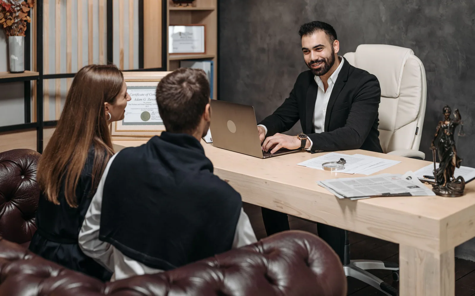 A small professional services team meeting with a business owner