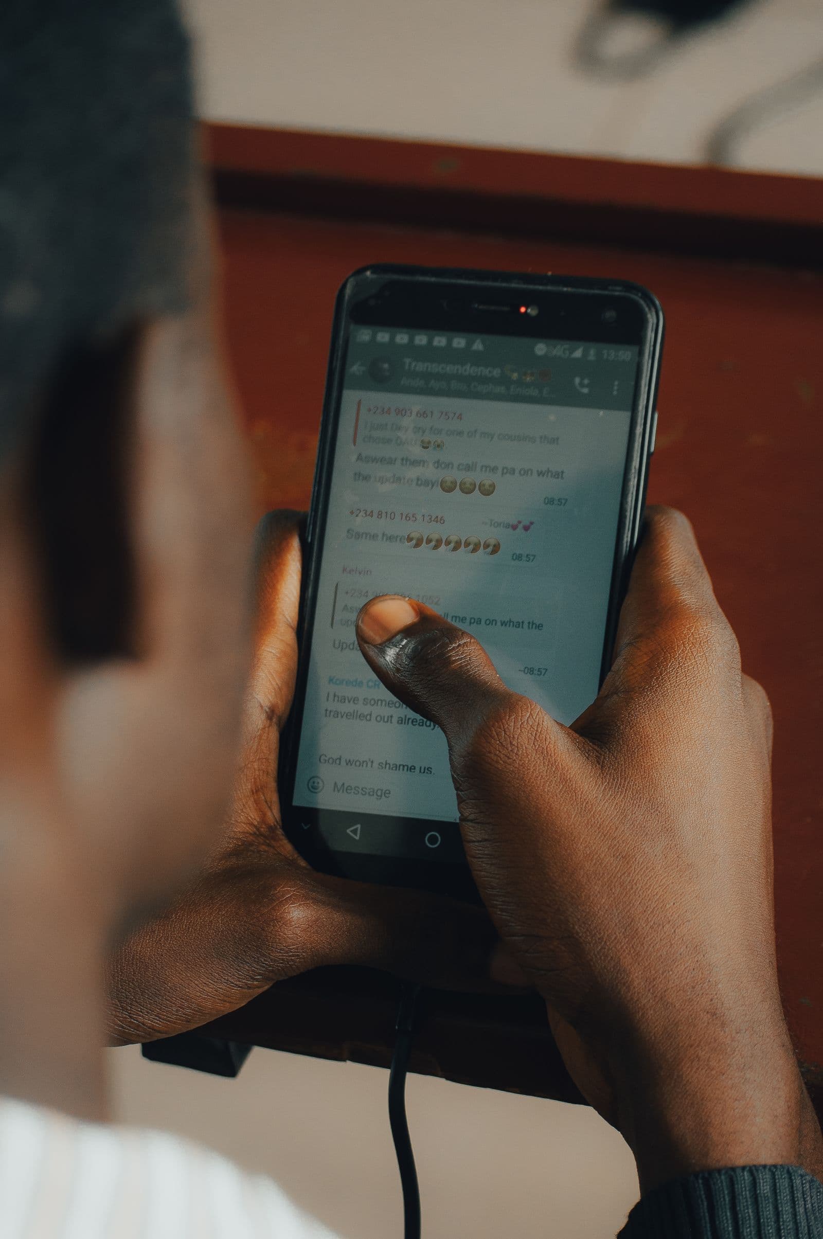A person reviewing a message on their phone
