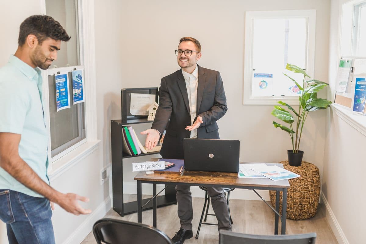 A financial services adviser speaking with prospective home buyers